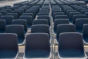 Many empty chairs without audience photo