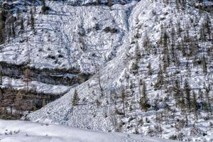 Avalanche snow slide in dolomites mountains photo