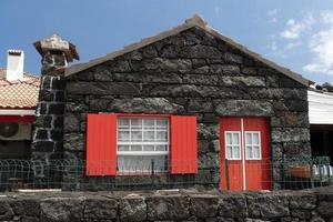 Lajido village Pico Island Azores black lava houses red windows photo