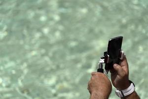 Tourist taking selfie at Fontana di Trevi fountain Rome photo