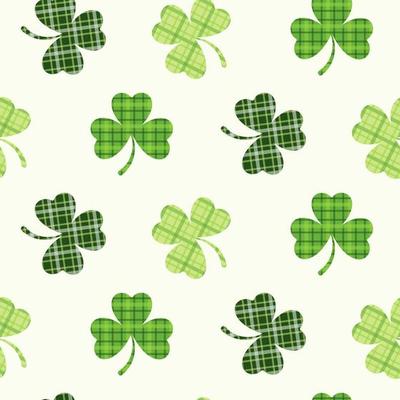 St. Patrick's Day seamless pattern of clover leaves in Irish plaid texture and on isolated background. Hand drawn design for St. Paddy day celebration, party decoration, scrapbooking, home decor.