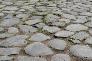 old stone roman road in rome photo