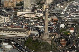 GENOA, ITALY - NOVEMBER 7 2019 - Harbor and lighthouse aerial view from helicopter photo