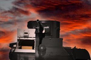 tank cannon aiming to enemy on fire sky photo