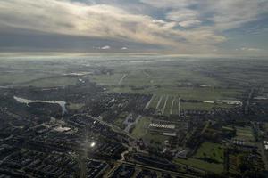 fog and clouds amsterdam area aerial view photo