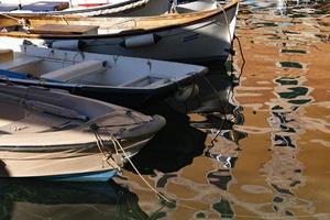 Camogli houses reflection in the harbor water sea photo