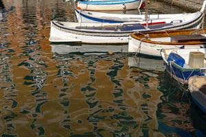 Camogli houses reflection in the harbor water sea photo