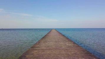 A flight over a wooden pier in the sea. video
