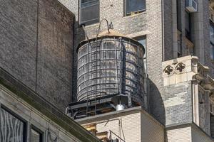 Water tank on new york skyscrapers roof photo