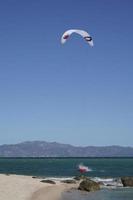 LA VENTANA, MEXICO - FEBRUARY 16 2020 - kite surfering on the windy beach photo