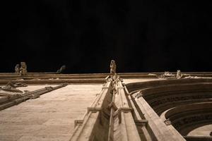 Valencia Silk Exchange Market building Lonja de la Seda gargoyles at night photo