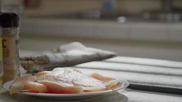 Woman Picks up Chicken Breast video