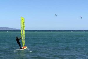 LA VENTANA, MEXICO - FEBRUARY 16 2020 - kite surfering on the windy beach photo