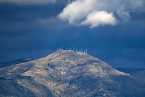 television antennas on top of mountain photo