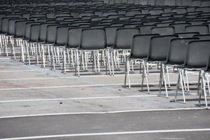 Many empty chairs without audience photo