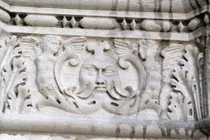 VENICE, ITALY - SEPTEMBER 15 2019 - doge ducal palace capital of column wayside sculpture detail photo