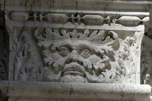 VENICE, ITALY - SEPTEMBER 15 2019 - doge ducal palace capital of column wayside sculpture detail photo