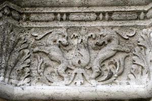 VENICE, ITALY - SEPTEMBER 15 2019 - doge ducal palace capital of column wayside sculpture detail photo