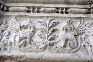 VENICE, ITALY - SEPTEMBER 15 2019 - doge ducal palace capital of column wayside sculpture detail photo