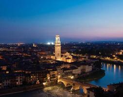 Verona, Italy - panorama by night. Illuminated cityscape with scenic bridge. photo