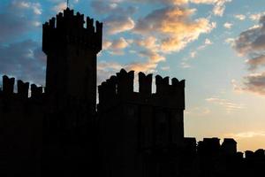 Sirmione, Italy - castle on Garda lake. Scenic mediaeval building on the water photo