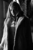 black and white portrait of a girl against the background of a night city photo