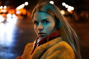 portrait of a girl against the background of a night city photo