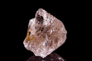 Macro mineral stone smoky quartz Rauch topaz on black background photo