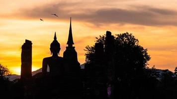 silhouette of Wat Temple beautiful temple in the historical park Thailand photo