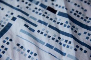 White cotton bed sheet design with blue pattern element photo