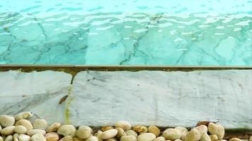 Water in the swimming pool filled with chlorine can erode marble floors