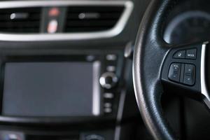 empty cockpit of vehicle control buttons on interior modern car  with  display Sound control loudspeaker or display car rear view system monitor reverse , View maps on the screen while traveling. photo