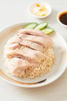 Hainanese chicken rice or rice steamed with chicken soup photo