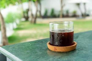 iced americano coffee glass on table photo