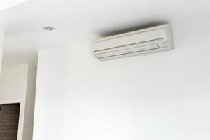 Wall mounted air conditioner in white house photo