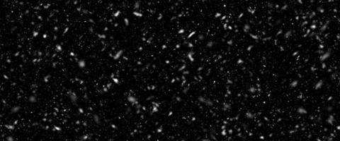 Snowfall bokeh on dark foundation. Numerous snowflakes in flying in the air. Winte night snowfall and snowstorm of snow at. Obscure bokeh light impact innovative foundation. photo