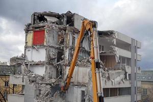 Multistorey Building Demolished and Dismantled by Machine photo