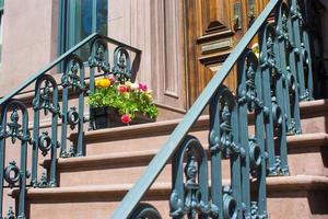 Old houses with stairs in the historic district of West Village photo