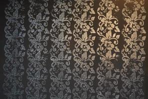 Gradient Gold and Silver Floral and foliage pattern in dark black background. photo