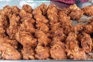 Asia Fried Chicken food street style in aluminum tray for sales. photo