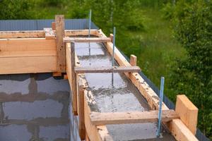 Foundation site of new house, building, details and reinforcements with steel bars photo