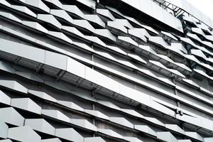 modern Aluminium composite material architecture gray color and Hexagon shape popup texture on exterior facade building. photo
