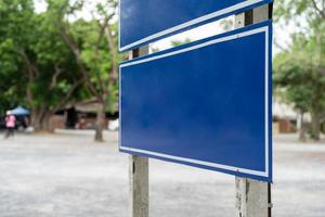 Blue traffic sign in paking lots with tree around. Clipping Paths photo