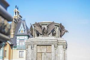 Antiquity in detail. Decoration of houses, balconies, windows, sculptures, walls. Elements of architectural design of buildings. Old plaster, Stone decorations. Elements of Gothic architecture photo