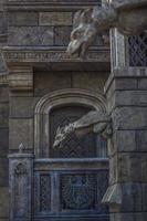 Antiquity in detail. Decoration of houses, balconies, windows, sculptures, walls. Elements of architectural design of buildings. Old plaster, Stone decorations. Elements of Gothic architecture photo