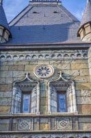 Antiquity in detail. Decoration of houses, balconies, windows, sculptures, walls. Elements of architectural design of buildings. Old plaster, Stone decorations. Elements of Gothic architecture photo