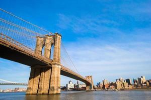 Brooklyn Bridge over East River viewed from New York City. Black and white. photo