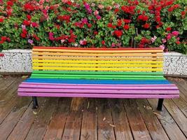 Rainbow flag bench after the rain in Valencia photo