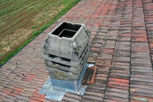 italiy tile roof chimney detail drone view photo