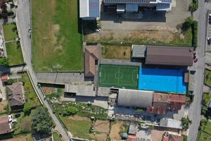 soccer field between houses aerial drone photo